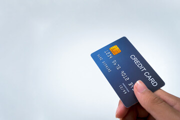 Credit card, in user's hand, focus on card, background. Isolate, banner, advertising space, copy space.