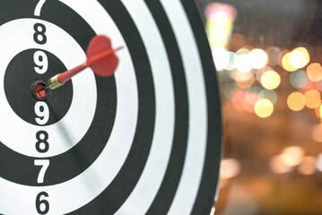 Dart Target Arrow Hitting Bullseye With Bokeh Background