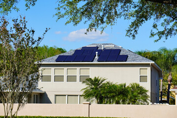 Solar panel on a house roof; Green energy from sun	