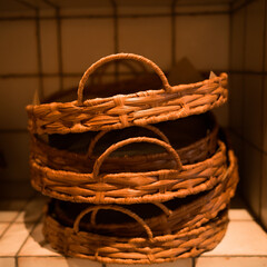 Three bread baskets photographed inside a café.
