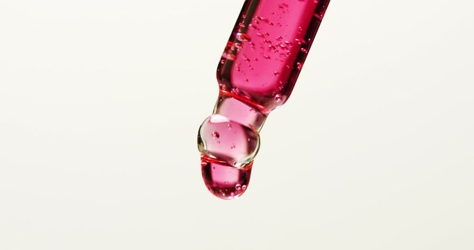 Dropping serum, gel, oil or other cosmetic products from a pipette.
