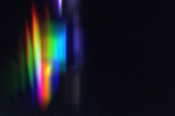 rainbow light leak prism light colorful photo overlay on black background.