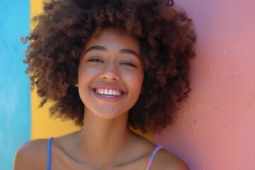 Happy young woman with afro hairstyle against colored background - generative ai - obrazy, fototapety, plakaty