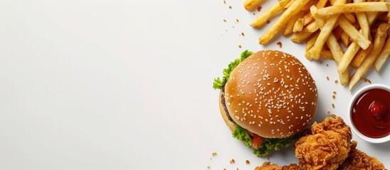 Mock up of a burger, fries, and fried chicken arranged together on a white background. There is space available for text and a logo. Clipping path is included for easy editing.