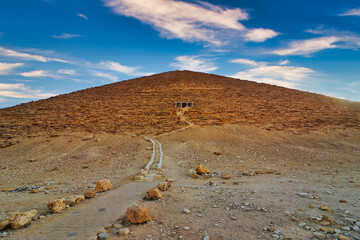 Red Pyramid at Dahshur is the first true pyramid built by the great pharoah Snefuru of the 4th dynasty at around 2575 bc, with a staircase leading to the entrance at Cairo,Egypt