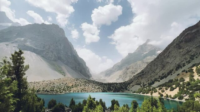 The Alaudin (Chapdara) lakes, lying at an altitude of 2800 m, are considered one of the most beautiful lakes of the Fan Mountains. Turquoise mountain lake. Pamiro-Alai. Tajikistan, Pamir 4K