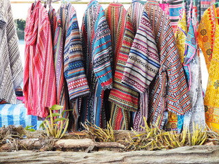 Hill tribe style clothes. Brightly colored hand-woven long-sleeved shirt and beautifully patterned...