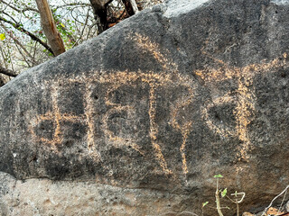 A rock with the word "Mahadev" written on it.