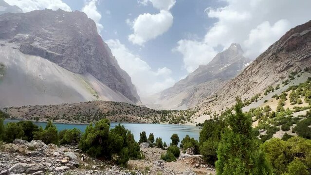 The Alaudin (Chapdara) lakes, lying at an altitude of 2800 m, are considered one of the most beautiful lakes of the Fan Mountains. Turquoise mountain lake. Pamiro-Alai. Tajikistan, Pamir 4K