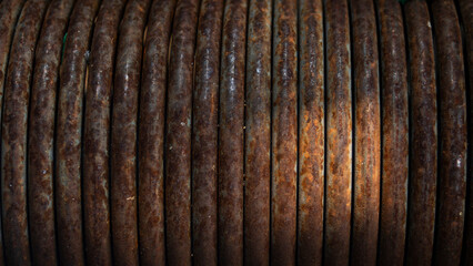 Old rusty metal coil, closeup of photo, background and texture
