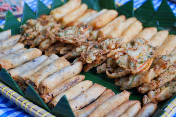 various fried foods, risol, piscok and otak-otak ready to be served