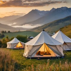 tent in the mountains in summer,countryside scene  glamping tents set against a backdrop of rolling hills and majestic mountains, providing a luxurious camping experience amidst pristine natural surro