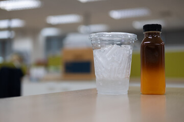 Drinks for a relaxing afternoon at the office. Black coffee mixed with sweet orange juice placed in the iced cup. Creative coffee
