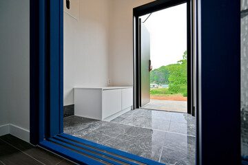 Install a sliding or folding door at the entrance to block drafts