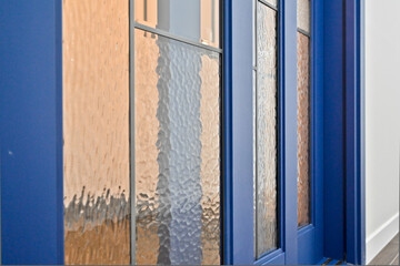 Install a sliding or folding door at the front door to block drafts