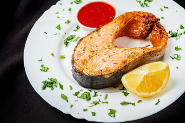 salmon steak with sauce and lemon - 787805130