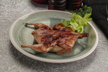 Grilled quail in the plate
