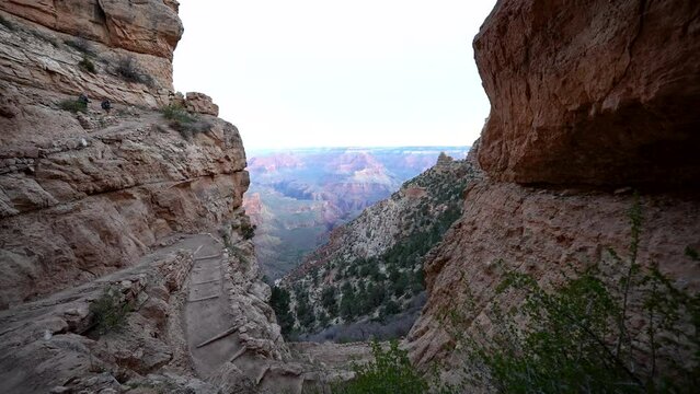 early morning light and a view from the South Kaibab Trail along the rim of the Grand Canyon with switchbacks for hiking