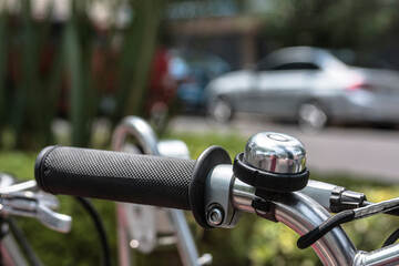 Part of a bicycle handlebar with handbrake and bell, Healthy lifestyle concept