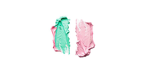 Pastel pink and green colored face cream swatch on a white background