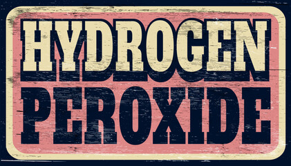 Aged and worn hydrogen peroxide sign on wood