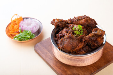 Dry chicken ghee roast in malvani, goan and konkani cuisine with nalli.