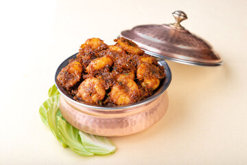 Kolambi fry or kolivada, a goan, konkani and a malvani dish made out of prawns or shrimp. Also known as prawn tikka.