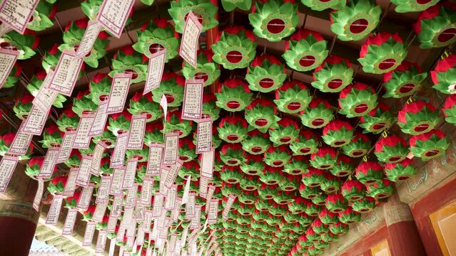 Celebrating Buddha's Birthday in Bulguksa temple in Gyeongju, South Korea. Colored paper lanterns celebrate Siddhartha Gautama Birthday. UNESCO World Heritage site. High quality 4k footage.