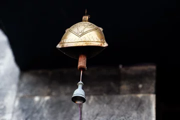 Foto op Plexiglas  a brass bell in the monastery © FeriFerdinan