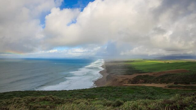 Time Lapse of Rainbow, Waves, and Clouds Moving over Beach at Point Reyes, California