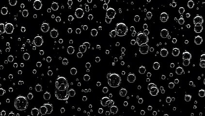 Closeup - rain water drops behind glass look like bubbles in black liquid. Abstract wet background.