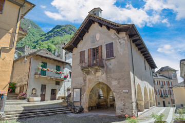 Ancient and characteristic square with historic buildings in a small Italian village. Vogogna town and the Praetorian Palace (palazzo Pretorio) built in 1348, north Italy