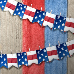 Closeup view of the American flag hanging on the rope - obrazy, fototapety, plakaty