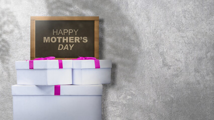 Small chalkboard with Happy Mother's Day text and a gift box - obrazy, fototapety, plakaty