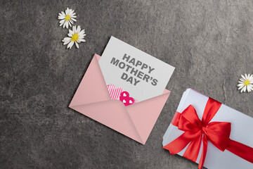 The letter with Happy Mother's Day text and a gift box - 787868156