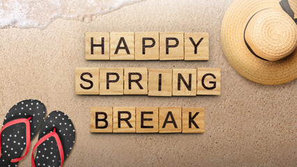 Slipper with beach hat and wooden cubes with Happy Spring Break text