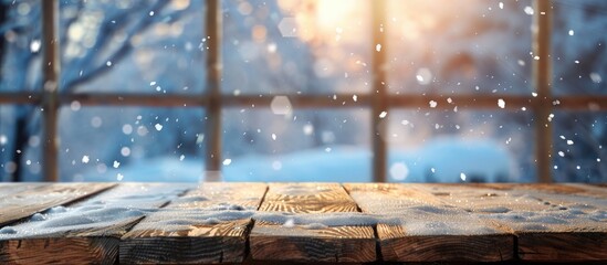 Wooden table with a blurred backdrop of a winter window