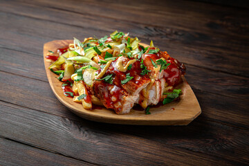 Smoked pork ribs with coleslaw on dark boards background. Menu for a pub