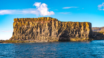 Mykines, Faroe Islands. Panoramic view of Mykines island, bird watching destination for puffins. Lighthouse at fjords landscape and seascape