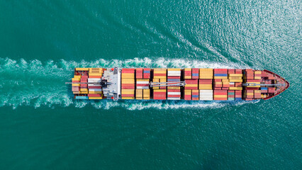 Express Cargo Container Ship with contrail in the ocean ship carrying container and running for...
