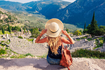 Tour tourism in Greece-Ancient city of Delfi, ruins of temple of Apollo, Theatre