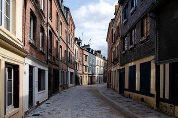 old cozy street with historic half timbered buildings in the the beautiful town of Honfleur, France...