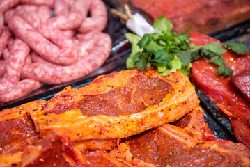 Closeup of butcher's hands holding meat piece in shop. High quality photo