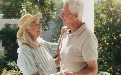 Obraz premium Mature people, man and woman in patio dancing for bonding, romance and love in relationship. Elderly couple, marriage and fun in garden or weekend with smile, happiness and affection with trust