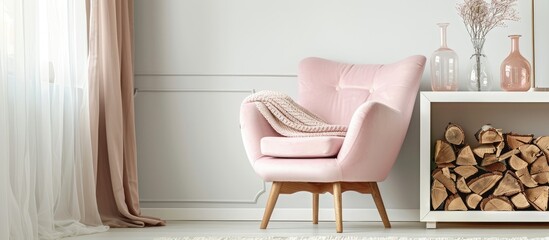 A cozy light pink chair sits beside a shelf filled with firewood in a delicate pastel bedroom adorned with decorative glass vases.