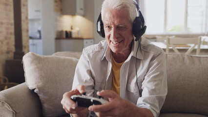 Headphones, senior man and joystick for video game, online streaming and relax for retirement at...