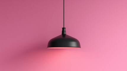 single black light fixture hanging against pink background