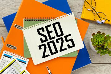 SEO 2025 two folders on the desktop. text on the page. notepad on folder