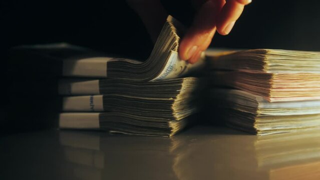 Stacks of Paper Currency on Reflective Surface