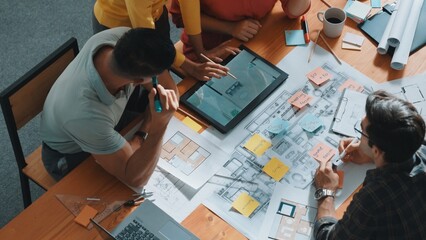 Top view of architect engineer team working together to plan house construction. Professional...
